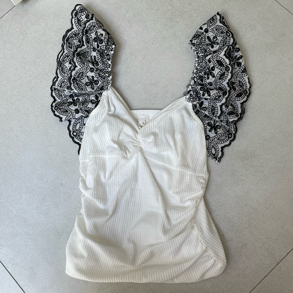 White, Small top. Cotton material.